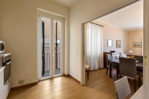 a living room with a table and a dining room at Balconcino sul Rivellino by BarbarHouse in Gallipoli