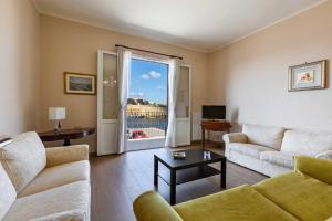 a living room with a couch and a table at Balconcino sul Rivellino by BarbarHouse in Gallipoli
