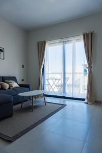 a living room with a couch and a table at Spacious family apartment in Mazatlán in Isla Venados