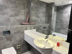 a bathroom with a sink and a toilet and a mirror at Private Studio Burj Khalifa Area -BEST PRICE in Dubai +22 photos