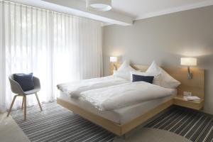Postel nebo postele na pokoji v ubytování Hotel Hiller in Abstatt