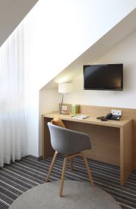 TV a/nebo společenská místnost v ubytování Hotel Hiller in Abstatt
