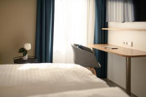 Postel nebo postele na pokoji v ubytování Hotel Hiller in Abstatt