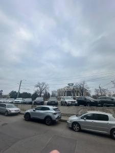 a group of cars parked in a parking lot at Lux Apartmen Zona Circ in Chişinău