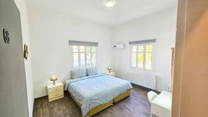 Uma cama ou camas num quarto em The Lemon Tree Hostel