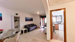 a living room with a couch and a table at BiBi House in Jávea