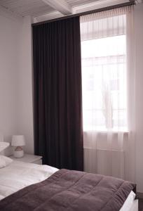 Postel nebo postele na pokoji v ubytování Laurentroom Hotel