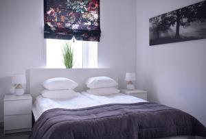 Postel nebo postele na pokoji v ubytování Laurentroom Hotel