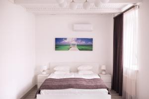 Postel nebo postele na pokoji v ubytování Laurentroom Hotel