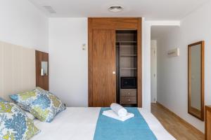 Postel nebo postele na pokoji v ubytování Hostal Neptuno