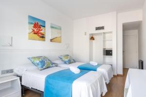 Postel nebo postele na pokoji v ubytování Hostal Neptuno