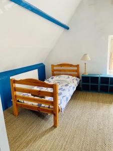 Cama o camas de una habitación en Une Chaumière à Port Manech'