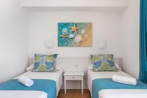 Postel nebo postele na pokoji v ubytování Hostal Neptuno
