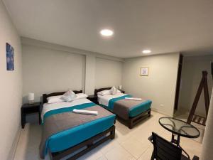 Voodi või voodid majutusasutuse Vianca Hotel toas