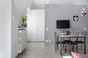 TV a/nebo společenská místnost v ubytování Casa Vacanze La Porta in Piazza