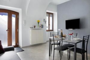 TV a/nebo společenská místnost v ubytování Casa Vacanze La Porta in Piazza