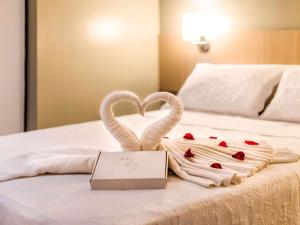 Cama ou camas em um quarto em ibis Styles Belém do Pará