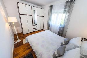 Voodi või voodid majutusasutuse Apartman Emily Zadar toas