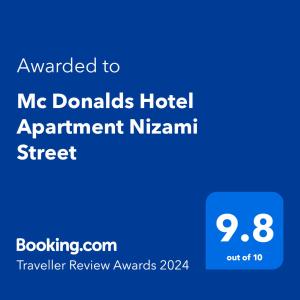 a blue sign with the text awarded to mgdonalds hotel apartment nhsarm at Mc Donalds Hotel Apartment Nizami Street in Baku