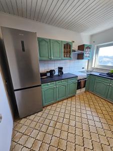 Kuchyň nebo kuchyňský kout v ubytování Gästehaus Weißes Lamm - MONTEURZIMMER