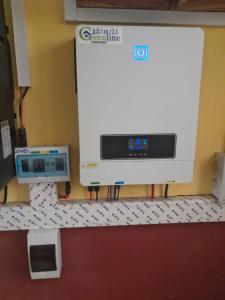 a washer and dryer on a counter in a room at Salama Hôtel Majunga in Mahajanga