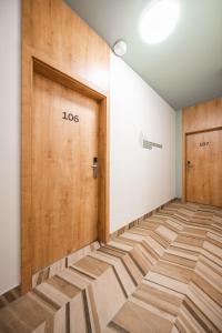 an empty hallway with two doors in a room at Luma Terra Prague Hostel in Prague