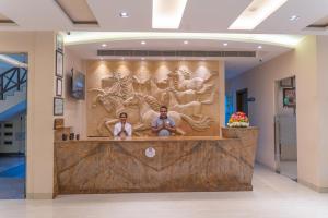 a wall with a picture of a man and a woman at Resort De Coracao - Corbett , Uttarakhand in Rāmnagar +37 photos