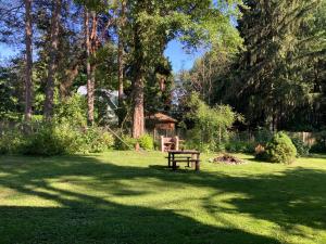 a park with a picnic table in the grass at Labākā vieta uz pasaules in Jūrmala