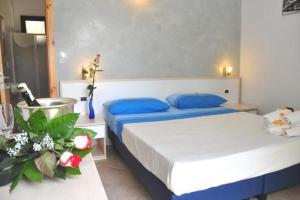 Postel nebo postele na pokoji v ubytování B&B La Zudrea
