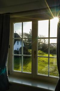 ヴェニングシュテットにあるAmelandの白い家の景色を望む窓