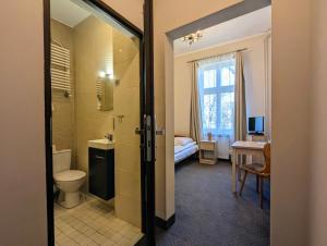 a bathroom with a toilet and a sink at OSW Świnoujście Rybitwa in Świnoujście