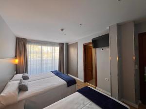 Postel nebo postele na pokoji v ubytování Hotel Montesol Benidorm + 37 fotografií