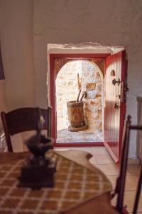 a miniature kitchen with a sink in a room at LITHOS TRADITIONAL TOWER in Areopoli +18 photos