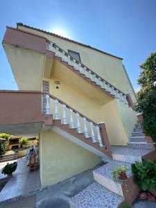 a building with stairs and a stair case at Εξοχικό με θέα στον Όλυμπο in Skotina