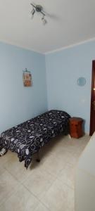 a black and white bench in a room at Tenerife Homestay in San Miguel de Abona