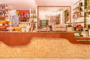 a counter in a store with bowls and dishes at Kraft Hotel in Paris +27 photos