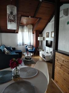 a living room with a couch and a table at Ana Apartment in Šibenik