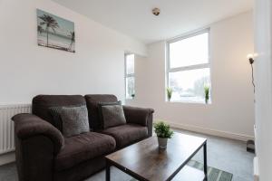 a living room with a couch and a coffee table at April Disc - Long Stay - Contractors in Bristol