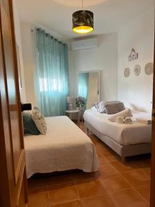 Katil atau katil-katil dalam bilik di Evens-Goretti House