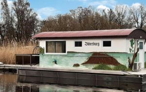 a building with a painting on the side of a body of water at 1 Bedroom Beach Front Ship In Havelsee Ot Ktzkow 
