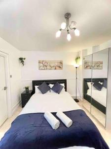 a bedroom with a large bed with two pillows at Great Studio flat in Central London in London