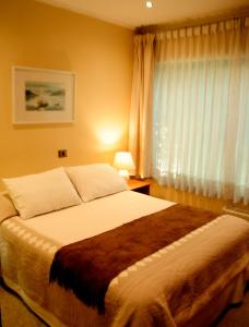 Postel nebo postele na pokoji v ubytování Hotel Seminario