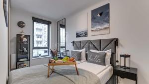 Giường trong phòng chung tại Scala City Center Premium Studios by Lion Apartments +92 ảnh