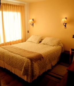 Postel nebo postele na pokoji v ubytování Hotel Seminario