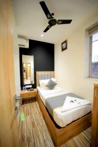 Ένα ή περισσότερα κρεβάτια σε δωμάτιο στο CABINSTAY-AIRPORT