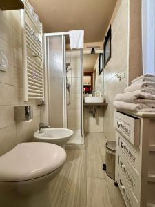 a bathroom with a toilet and a sink and a shower at Incantevole Casetta Veneziana in Venice