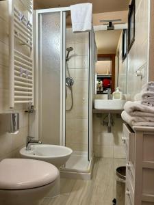 a bathroom with a toilet and a sink and a shower at Incantevole Casetta Veneziana in Venice