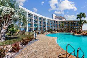 a hotel with a swimming pool and a resort at Pirates Bay A210 in Fort Walton Beach