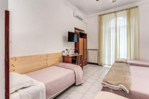Letto o letti in una camera di Hotel Altavilla 9