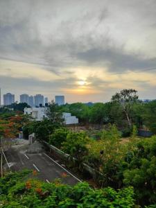 a view of a parking lot in a city at Happy Home 3BHK Condo - Muttukadu ECR in Chennai